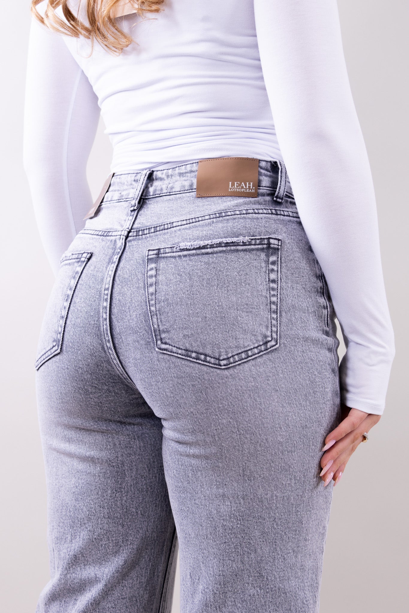 Wide leg stretch jeans with clean structured silhouette for women