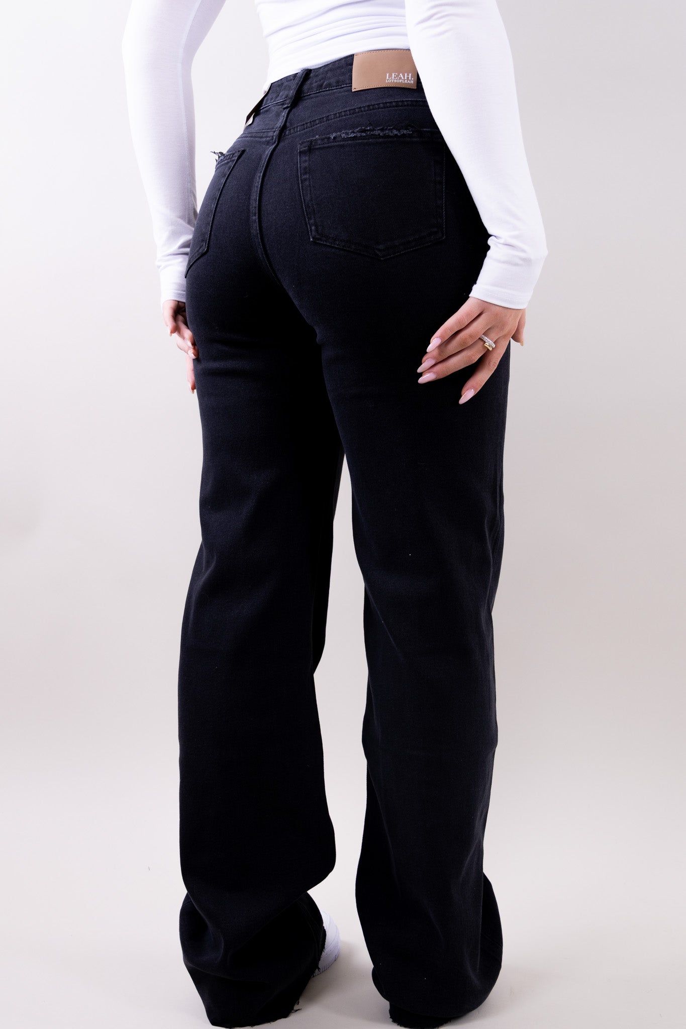 Wide leg stretch jeans with clean structured silhouette for women