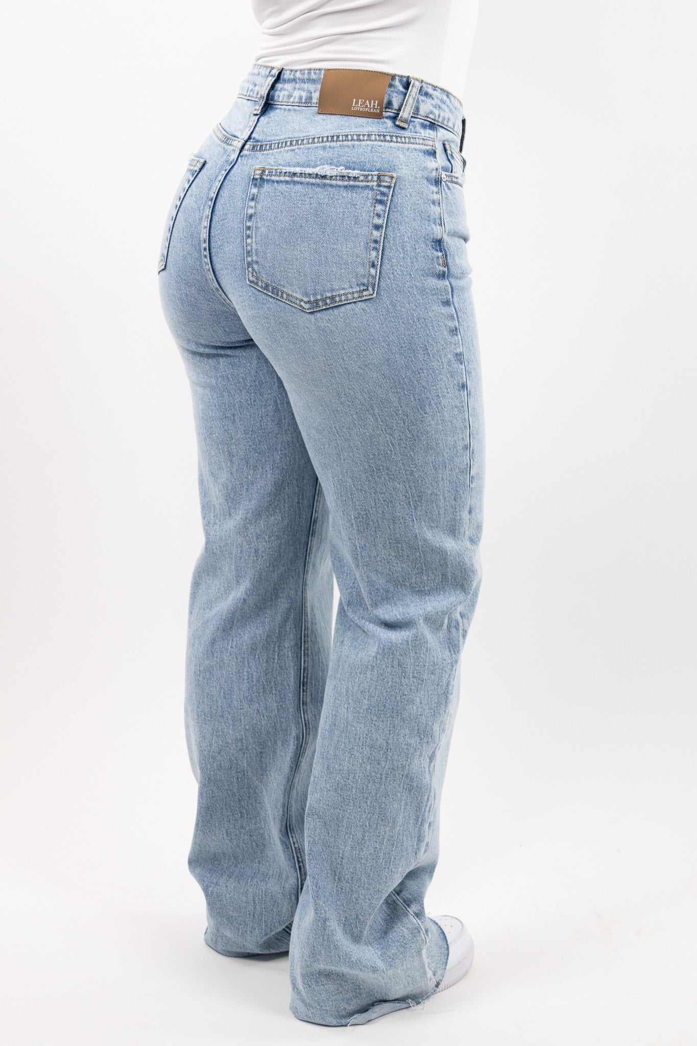 Wide leg stretch jeans with clean structured silhouette for women