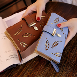portefeuille avec feuille d'or - Tendance et pratique