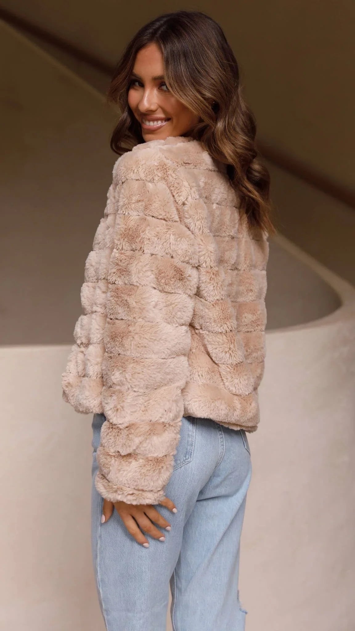 Women's short faux fur jacket with open collar